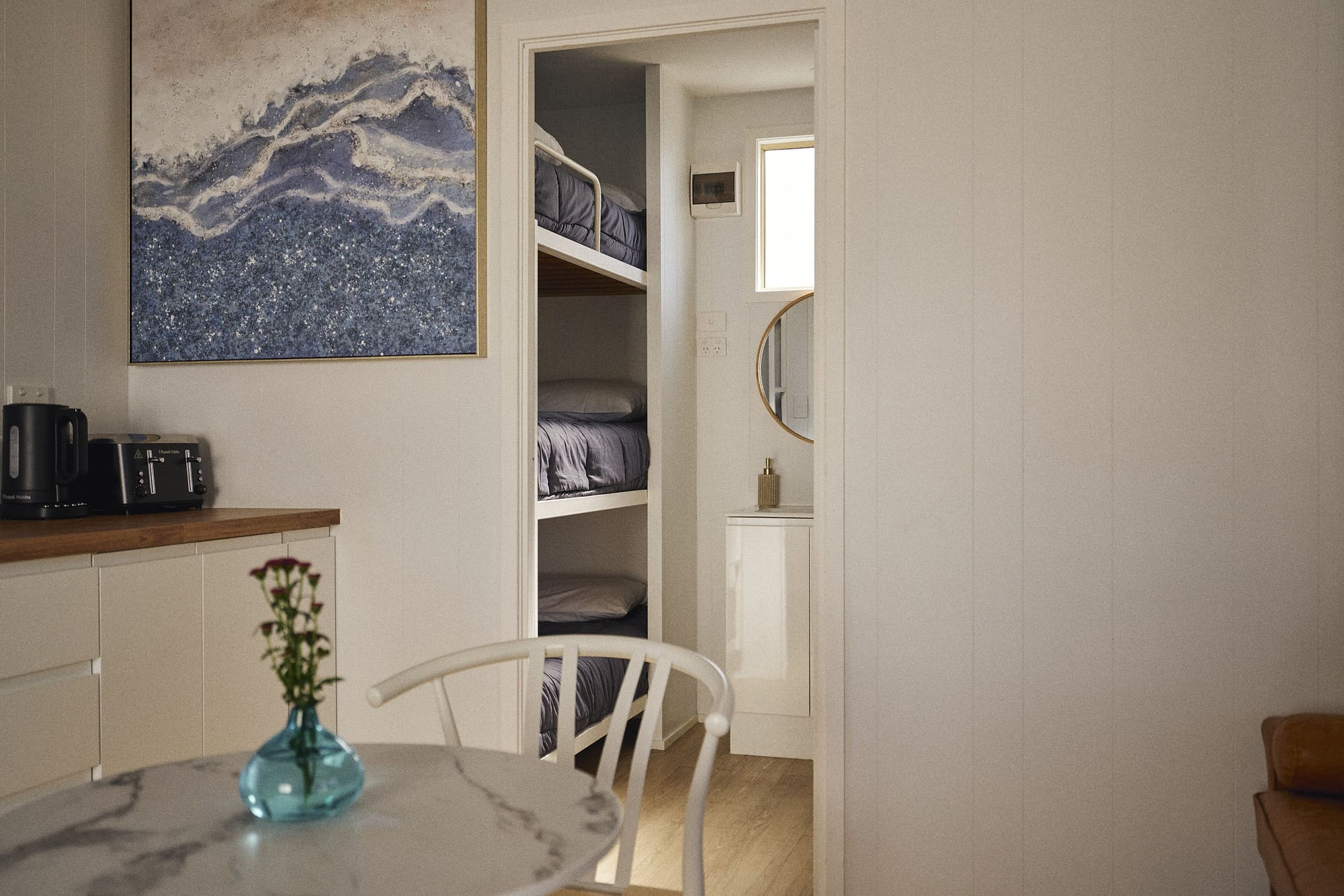 Entry to second bedroom with one set of single bunk beds in Clyde C Cabin.
