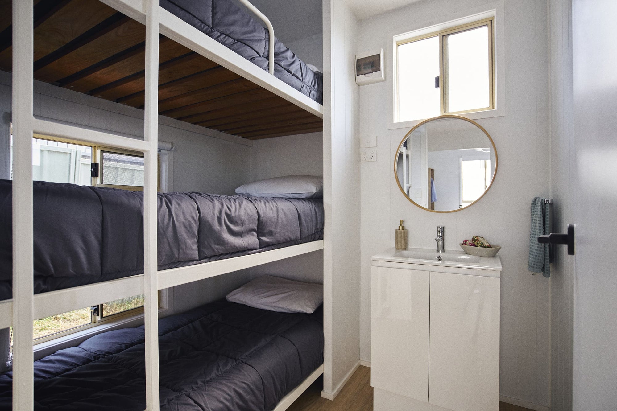 Second bedroom with view to the bathrooms vanity in Clyde C Cabin.