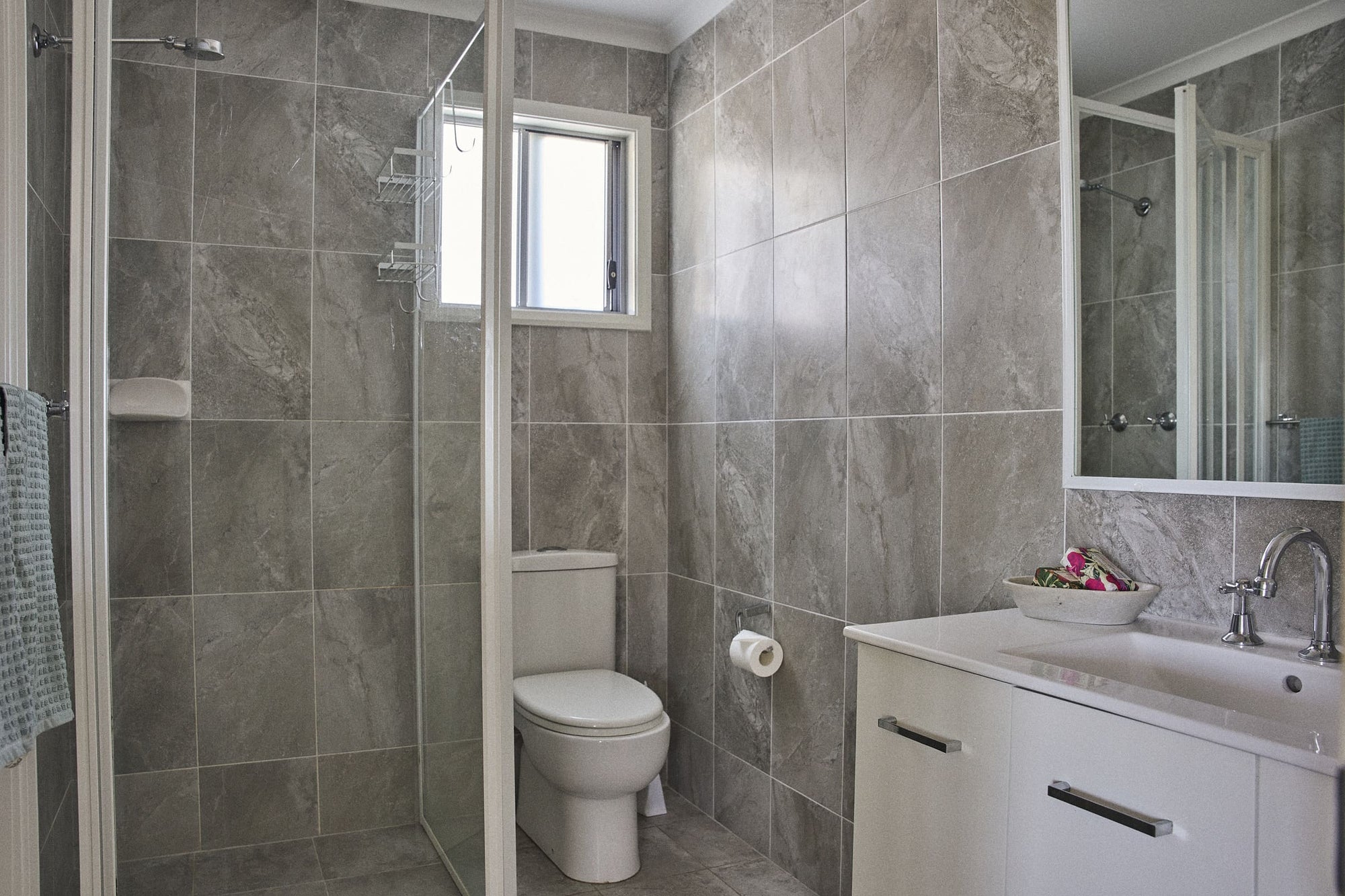 Bathroom vanity, shower and toilet in Currowan House.
