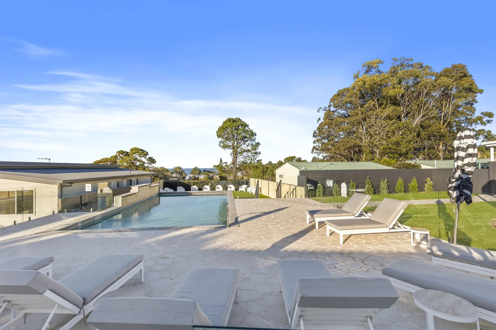 Renovated swimming pool and poolside lounge area at The Mook Mollymook.