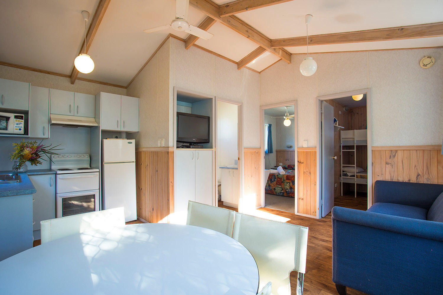 Kitchenette, dining, and living area in Yerriyong A Cabin.