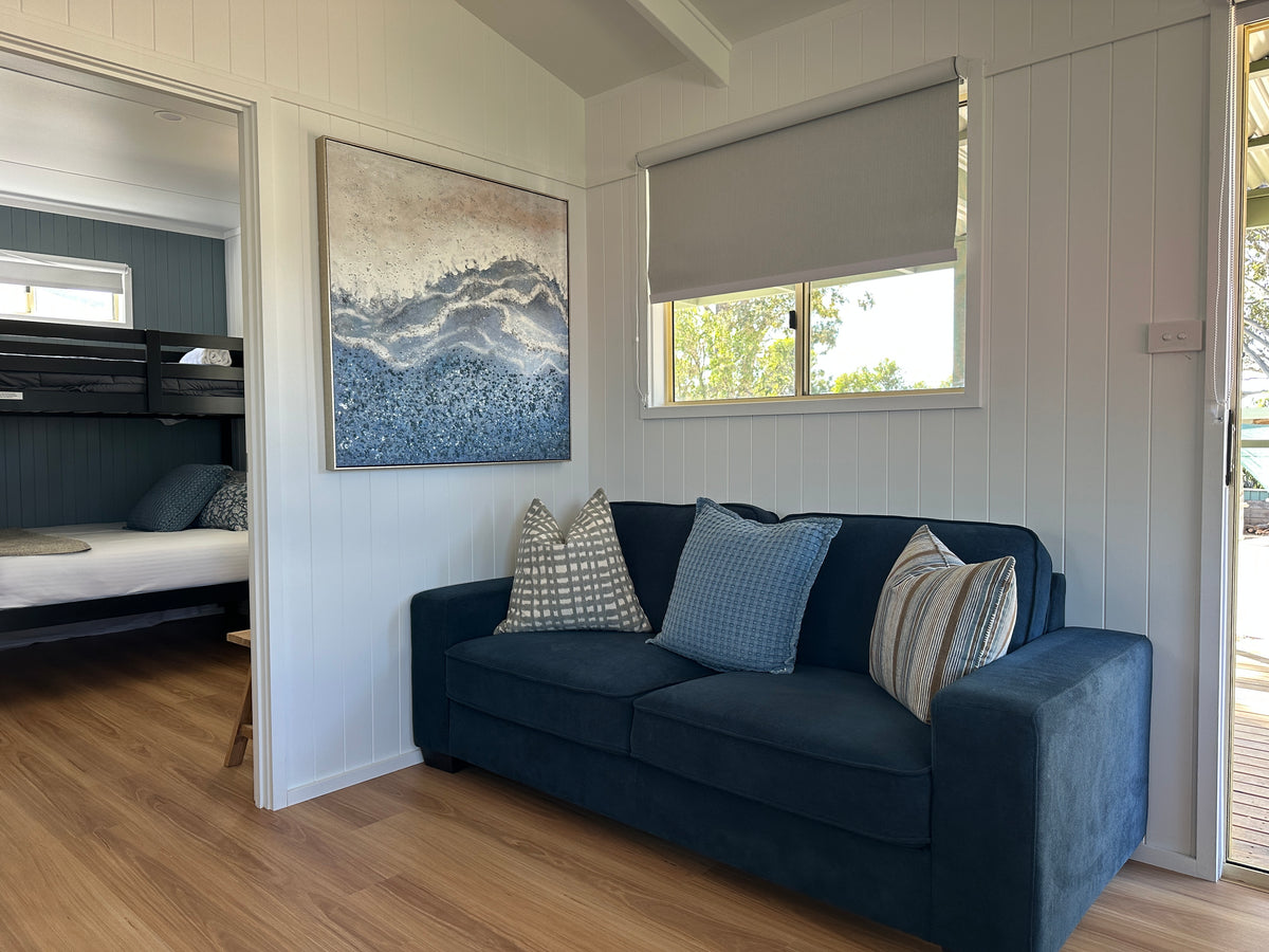Sofa in living area in Yerriyong C Cabin.