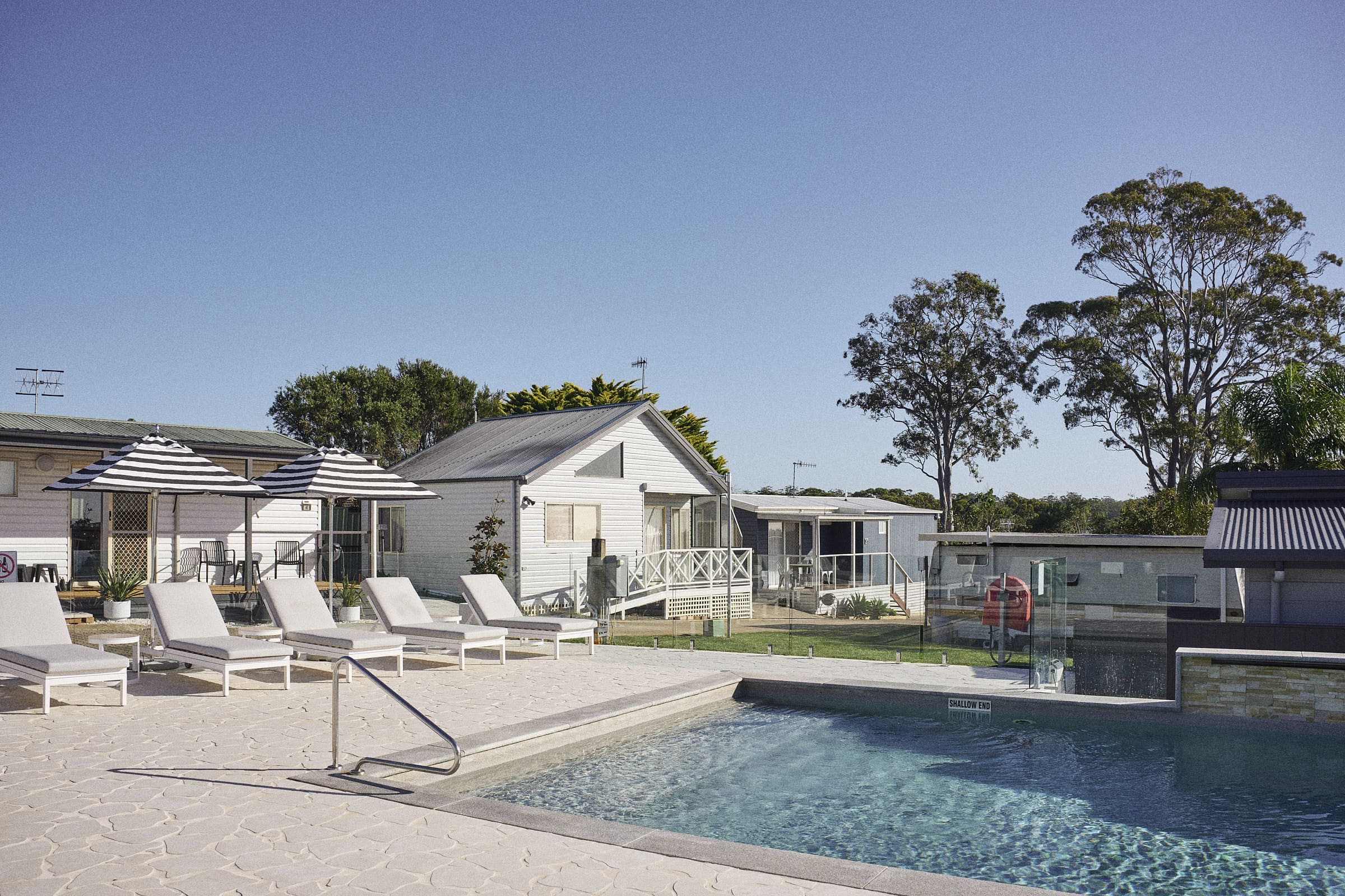 Renovated swimming pool and poolside lounge chairs at The Mook Mollymook.