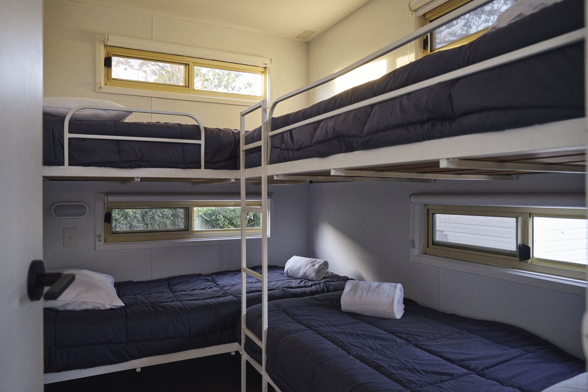 Second bedroom with sets of single bunk beds in Clyde B Cabin.