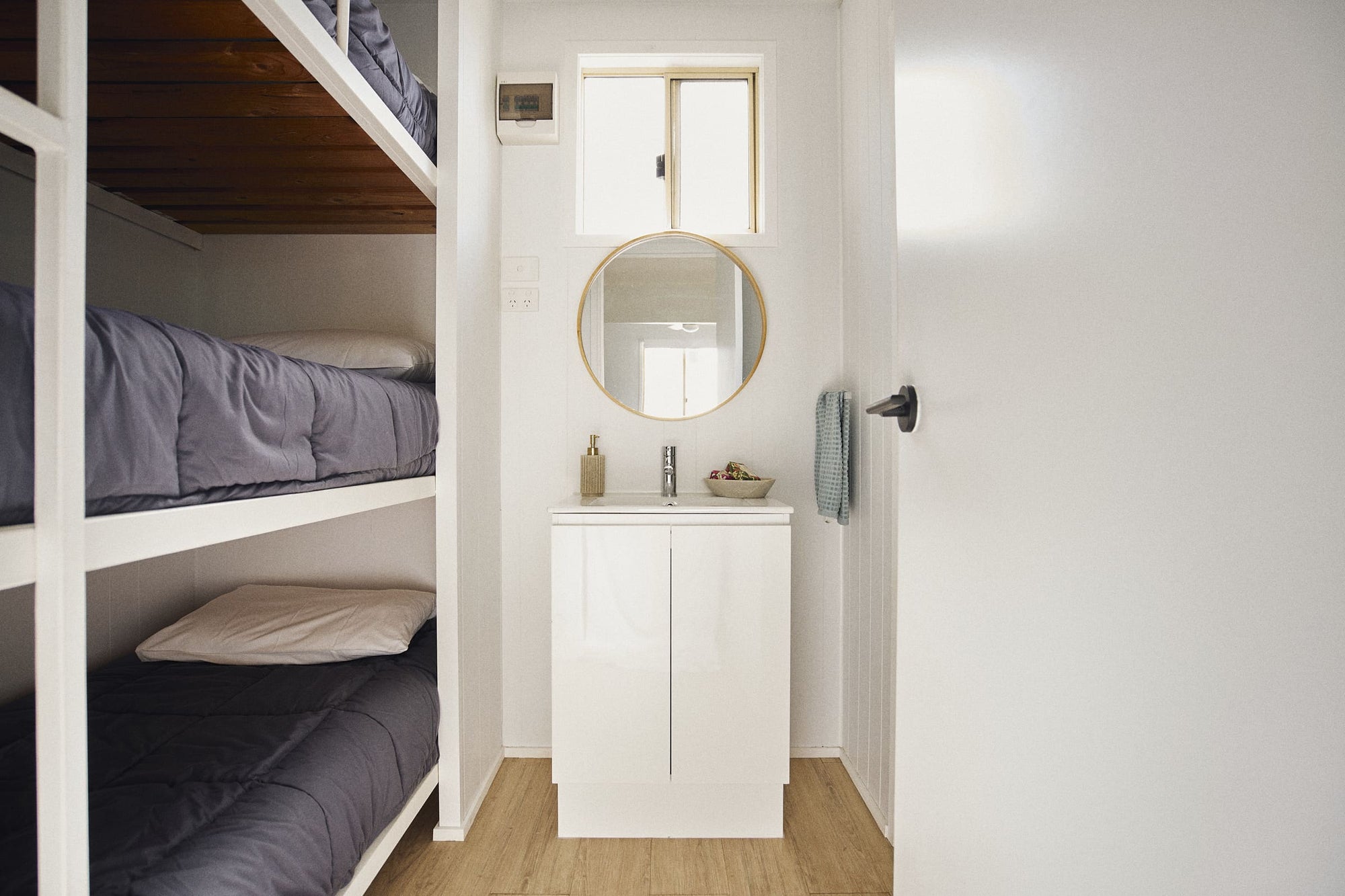 Second bedroom with view straigth  to the bathrooms vanity in Clyde C Cabin.