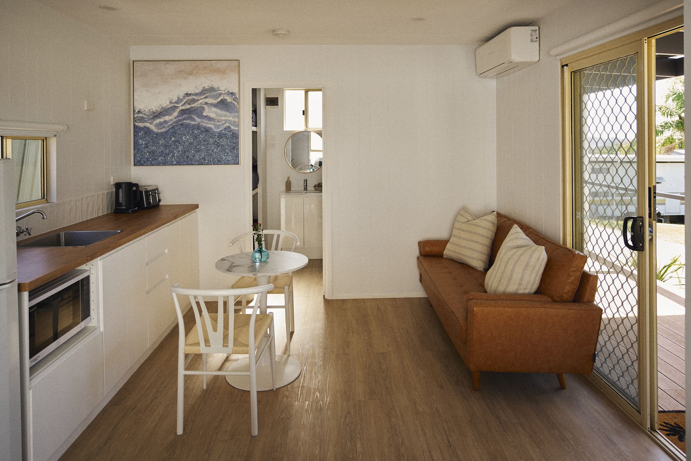 Modern open-plan living area in Clyde C Cabin.