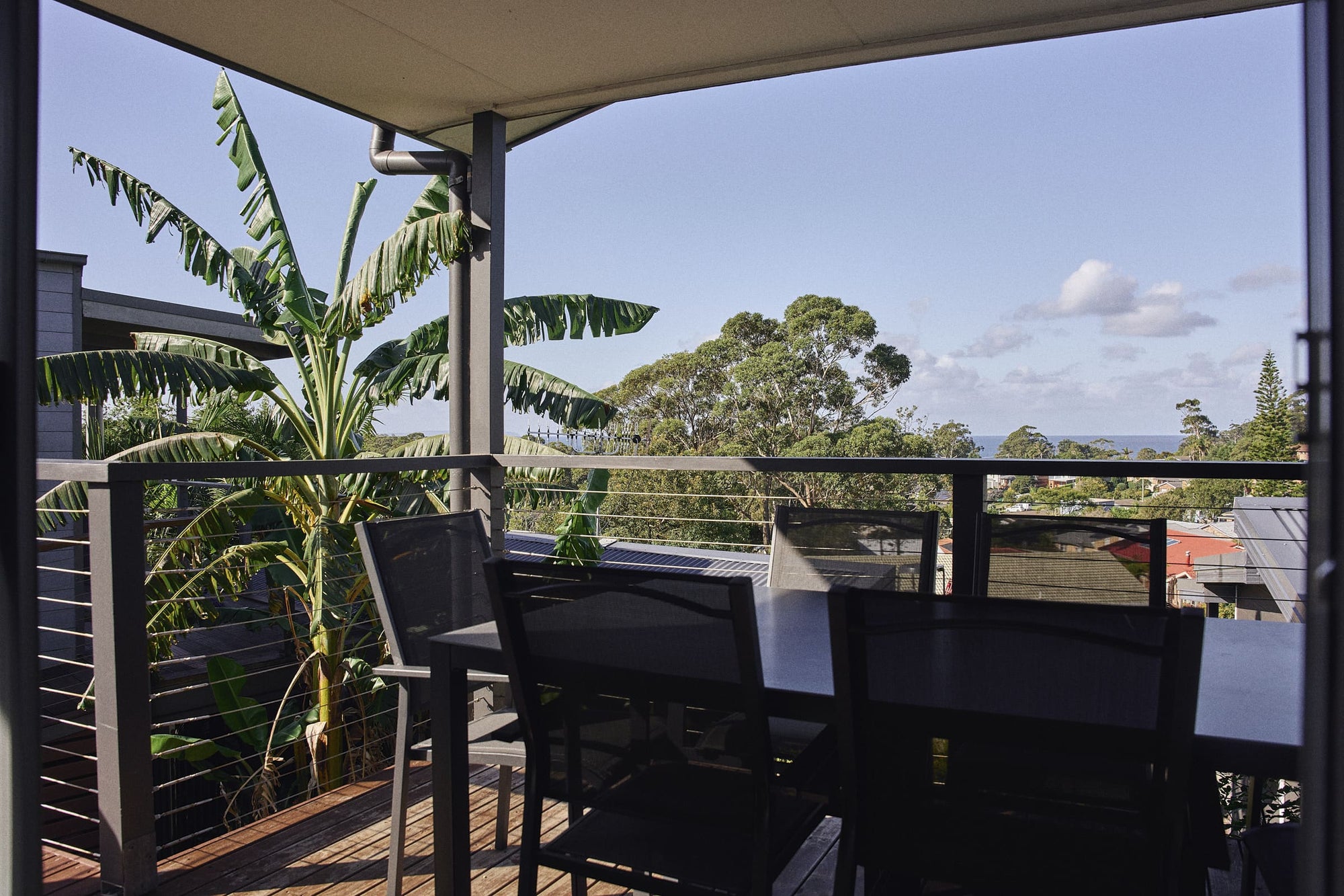 Covered balcony with outdoor seating  closeup in Currowan House.