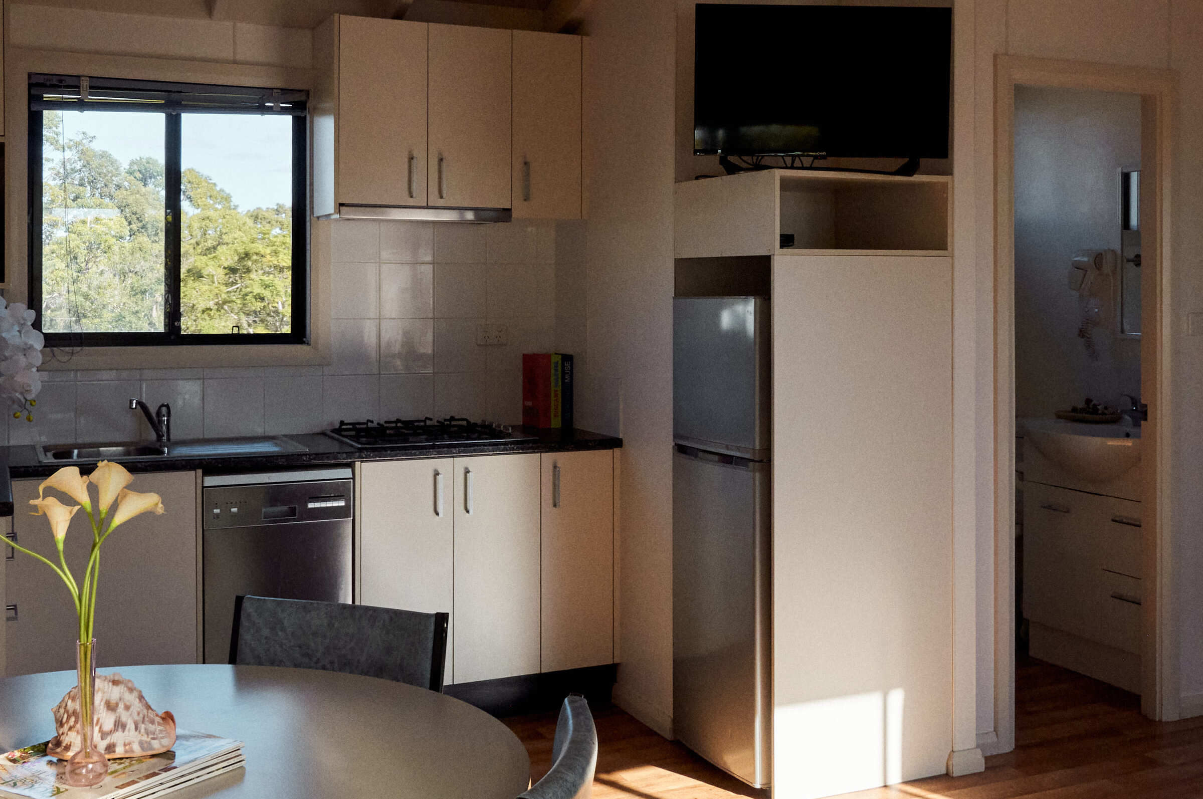 Kitchenette and dining area in Jerrawangala Cabin.