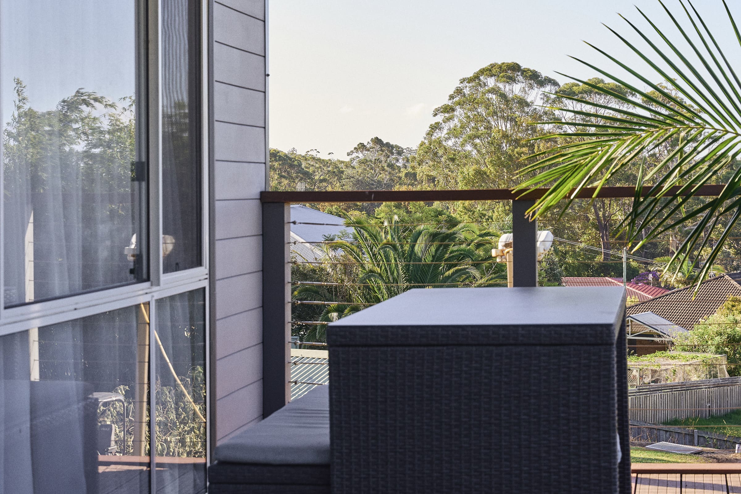Covered balcony with outdoor seating  closeup in Meroo House.