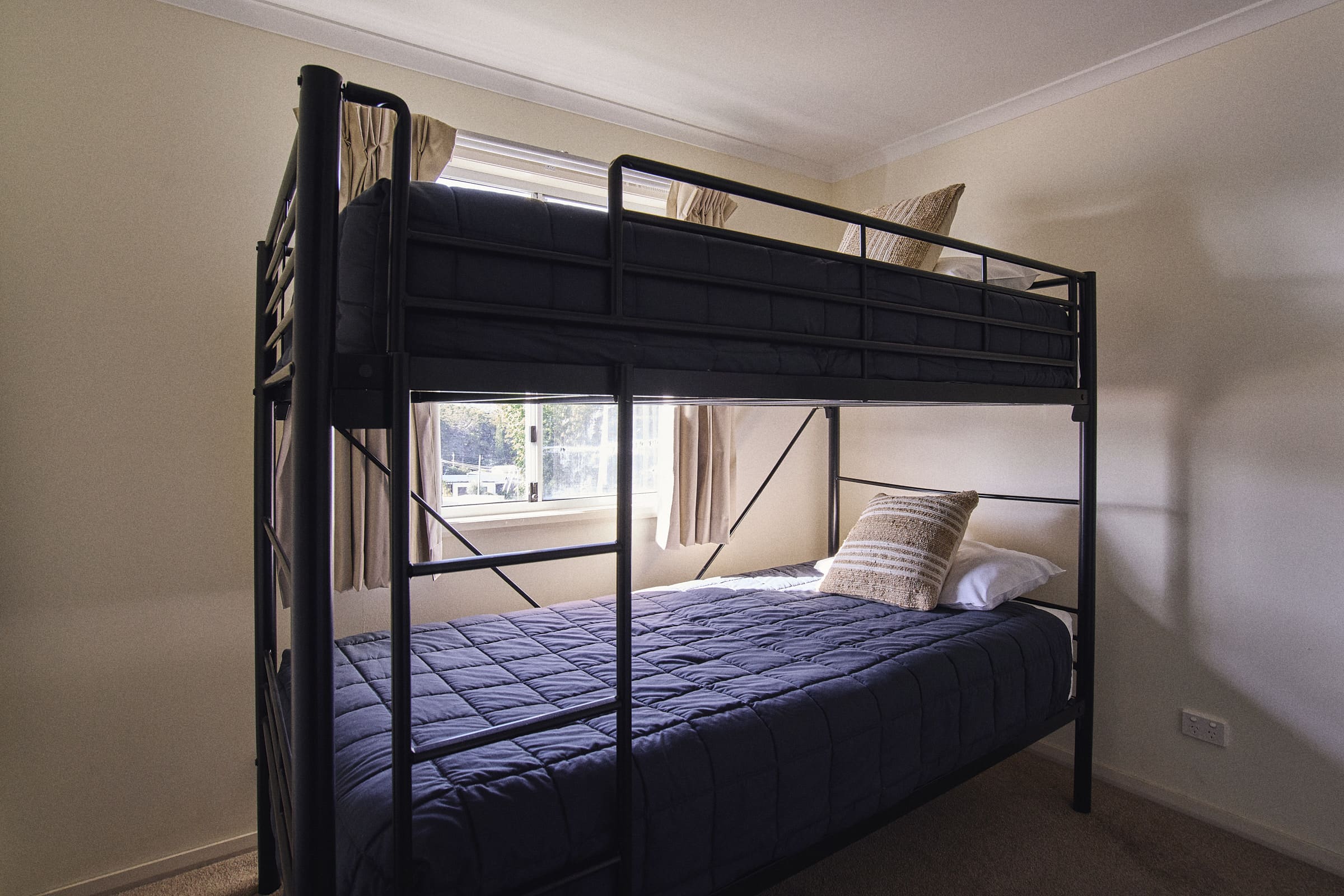 Second bedroom with a set of single bunk beds in Meroo House.