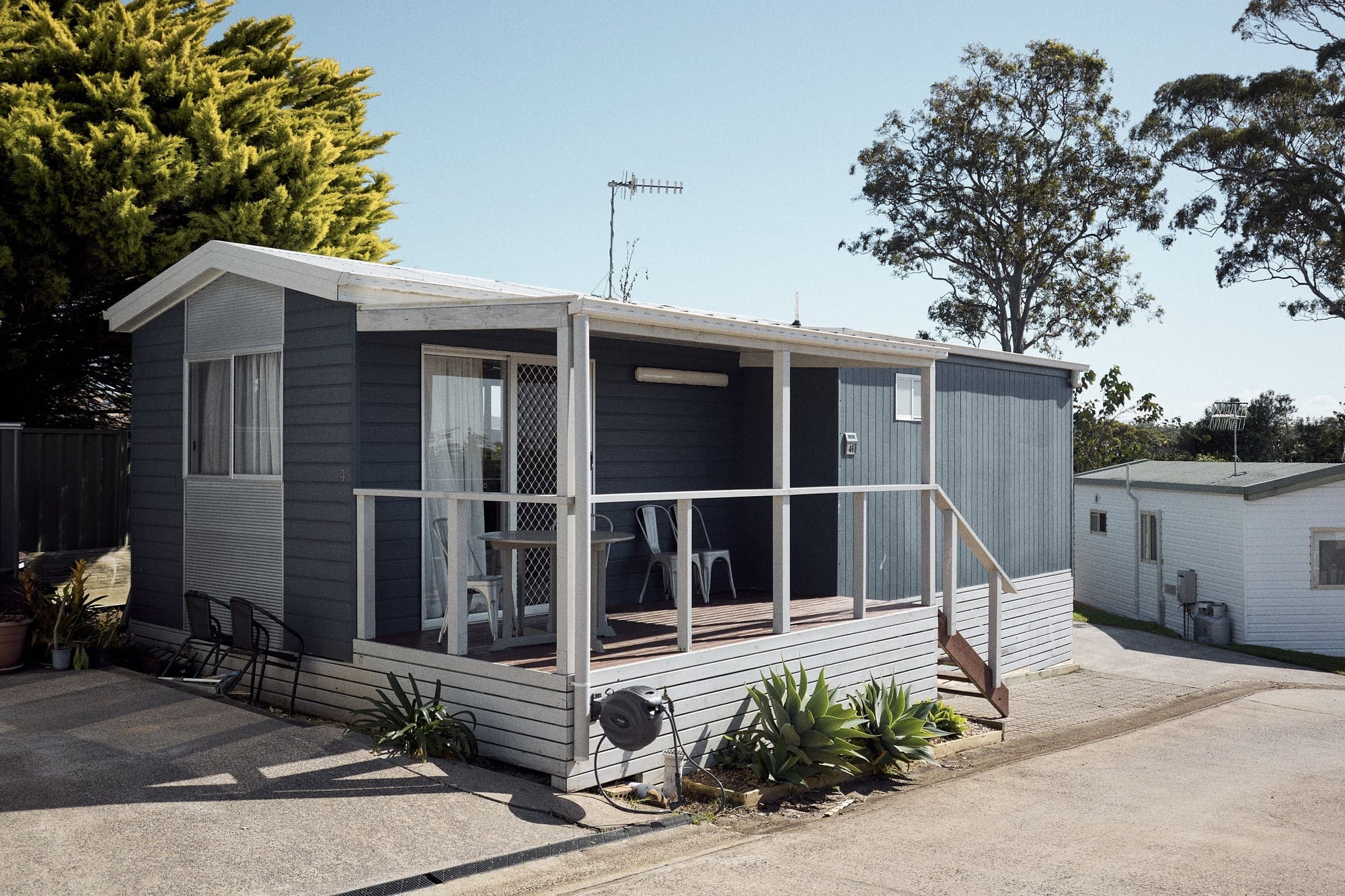 Morton A Cabin exterior with covered outdoor seating.