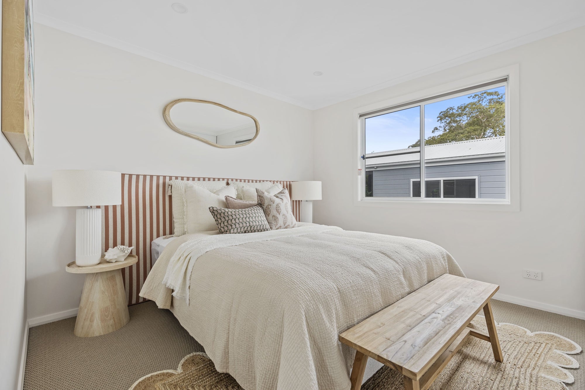 Main bedroom with queen bed at 32 Ilett Street residence.